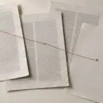 Overlapping photocopied journal pages with two hand-circled figures joined by a red thread, the thread ending on a blank page, beside an unlabelled amber dropper bottle